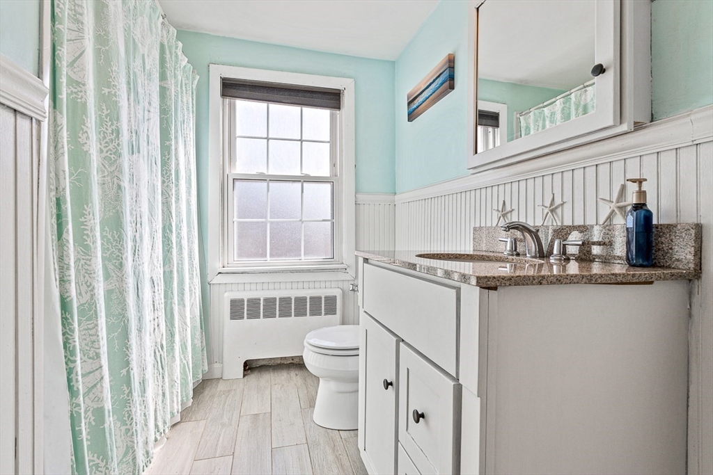 80 Neal Street Malden, MA 02148 - Photo 18 of 39 a bathroom with a sink and a mirror