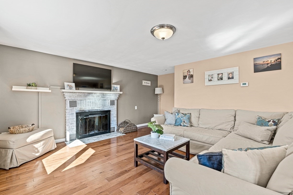 80 Neal Street Malden, MA 02148 - Photo 2 of 39 a living room with furniture a fireplace and a flat screen tv