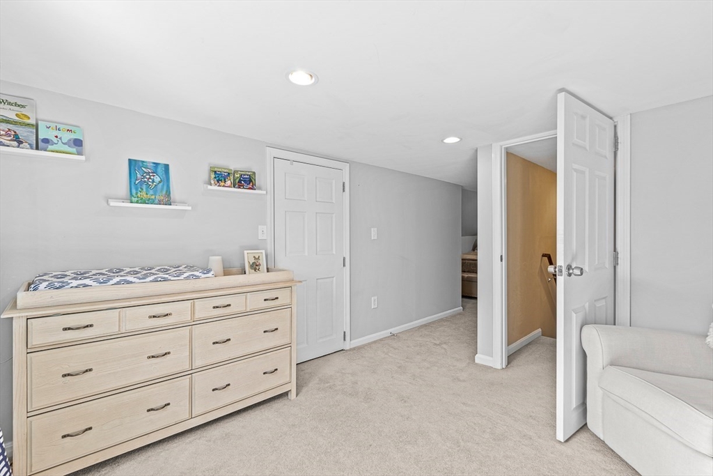 80 Neal Street Malden, MA 02148 - Photo 21 of 39 a room with a dresser and a couch