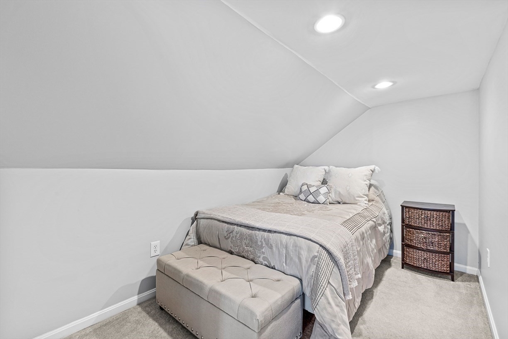 80 Neal Street Malden, MA 02148 - Photo 22 of 39 a bedroom with a bed and a couch