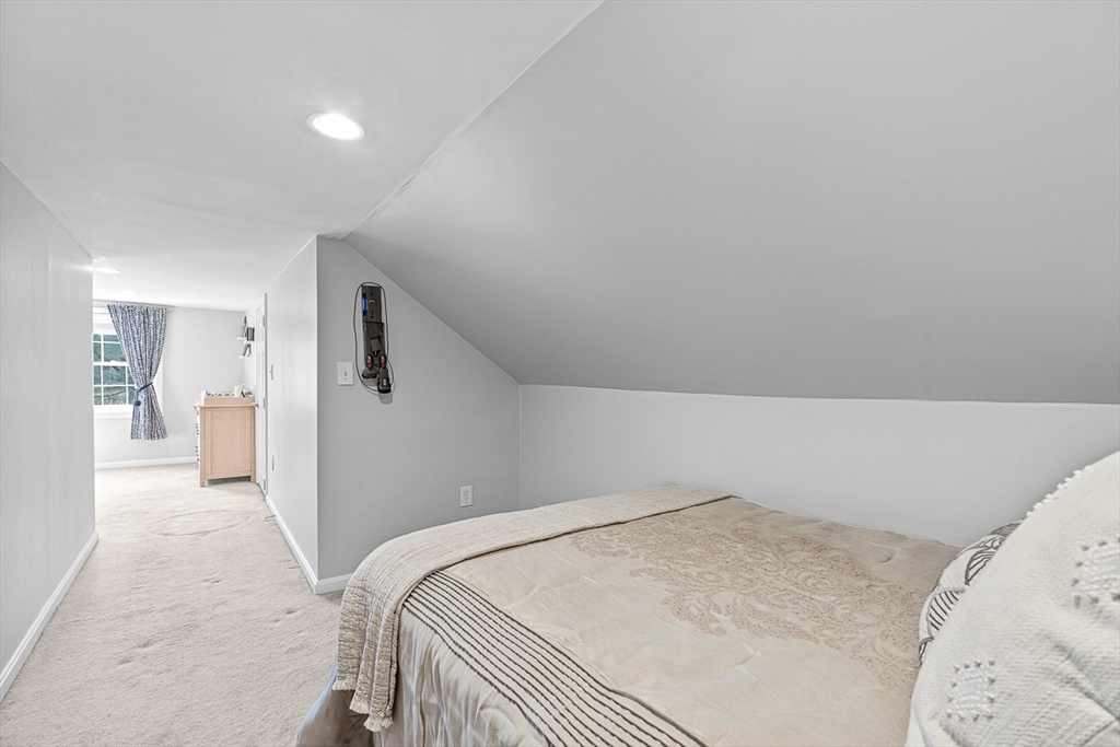 80 Neal Street Malden, MA 02148 - Photo 23 of 39 a bedroom with a bed and a view of bathroom