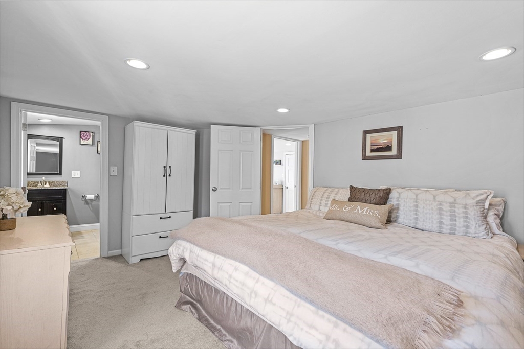 80 Neal Street Malden, MA 02148 - Photo 27 of 39 a spacious bedroom with a bed and a couch