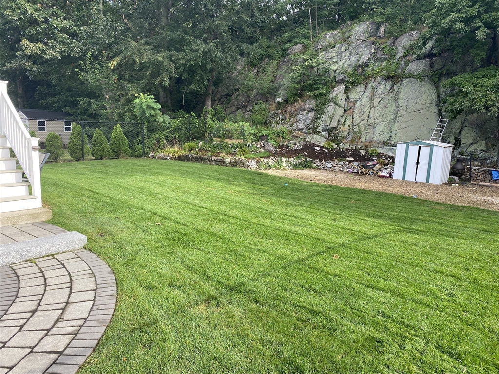 80 Neal Street Malden, MA 02148 - Photo 37 of 39 a view of a backyard with sitting area