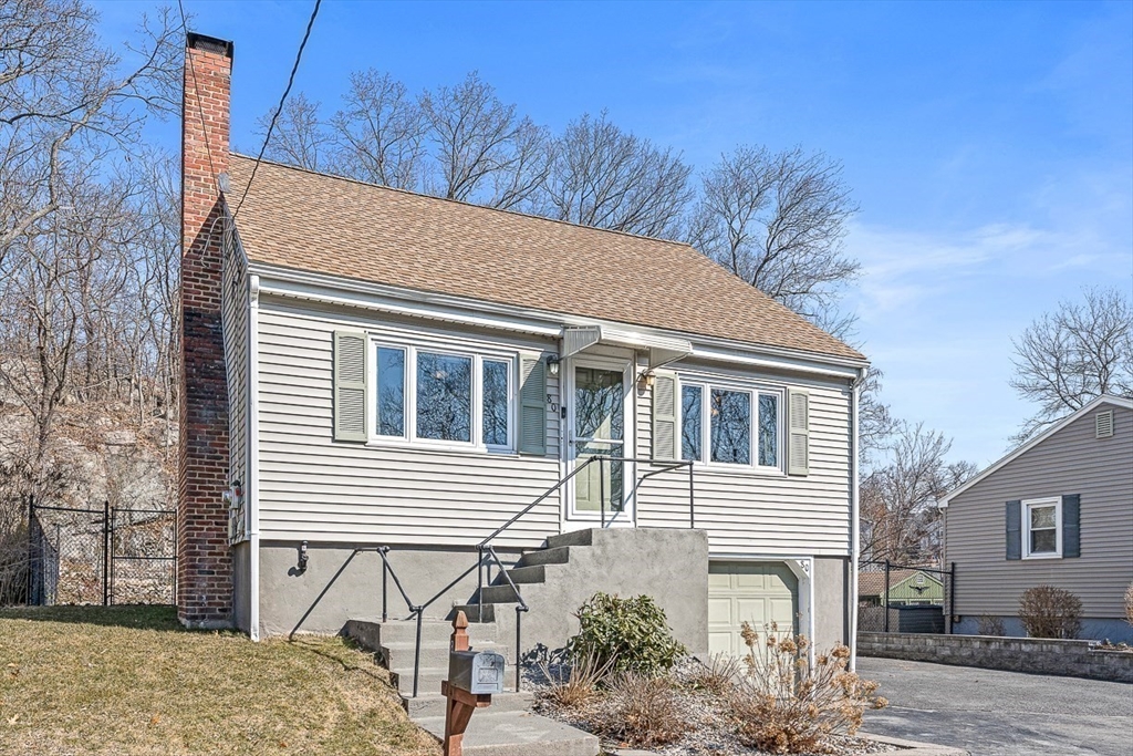 80 Neal Street Malden, MA 02148 - Photo 38 of 39 a view of house with backyard and trees in the background