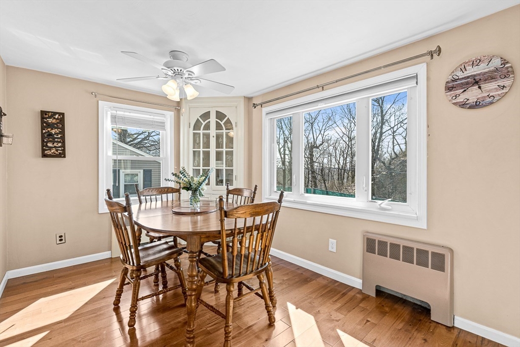 80 Neal Street Malden, MA 02148 - Photo 8 of 39 a view of a dining room with furniture a chandelier and wooden floor