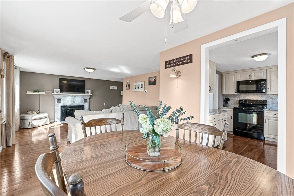 80 Neal Street Malden, MA 02148 - Photo 9 of 39 a view of a dining room with furniture a chandelier and wooden floor