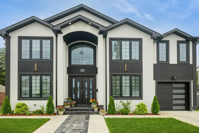 a front view of a house with garden
