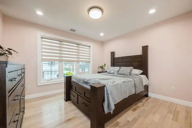 a bathroom with a sink a mirror a vanity and a shower