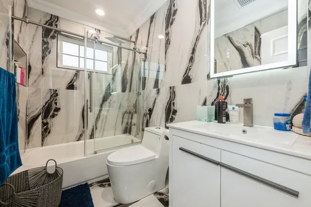 a bedroom with a bad and dresser