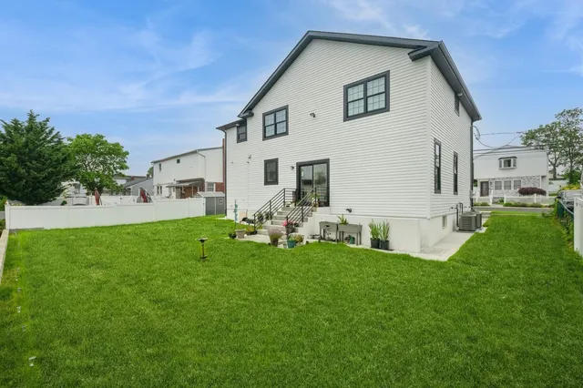 a front view of house with yard and outdoor seating