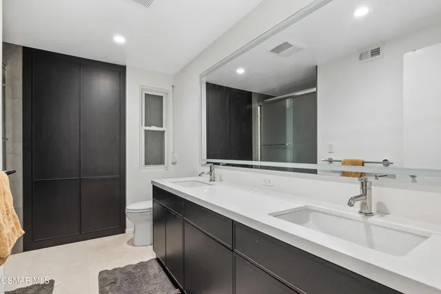 a bathroom with a sink and a large mirror