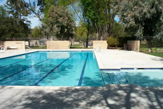 a view of a swimming pool with a patio