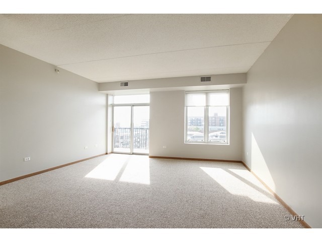 515 Main Street, Unit 507 Evanston, IL 60202 - Photo 2 of 10 a view of an empty room with a window