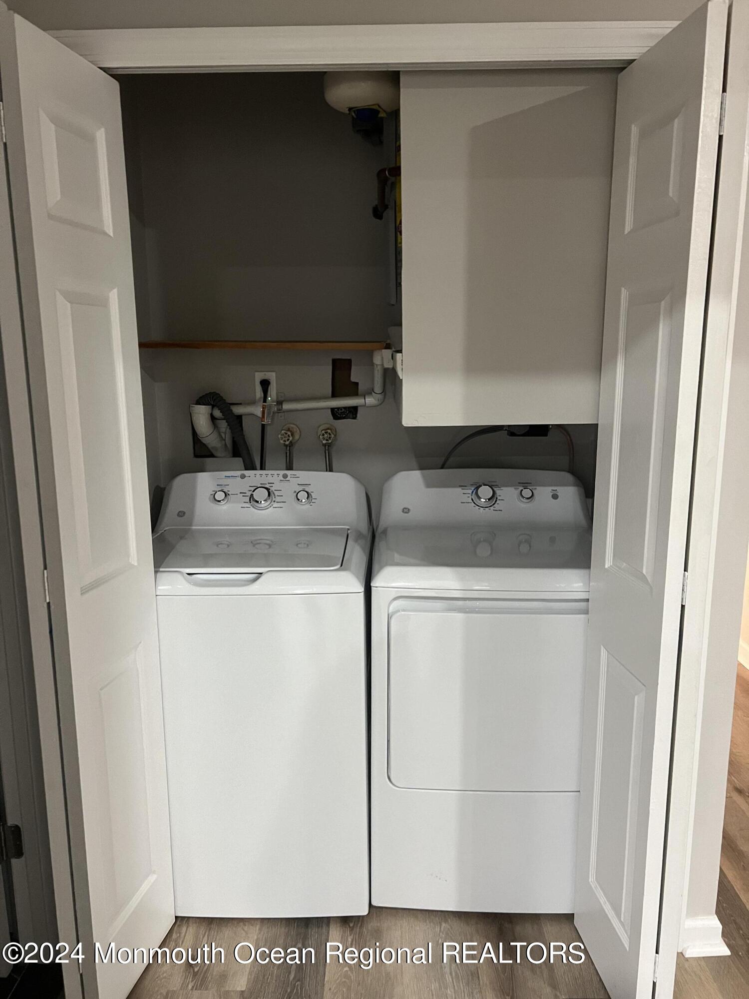 93 Halls Croft Road, Unit D Freehold, NJ 07728 - Photo 14 of 17 a utility room with dryer and washer