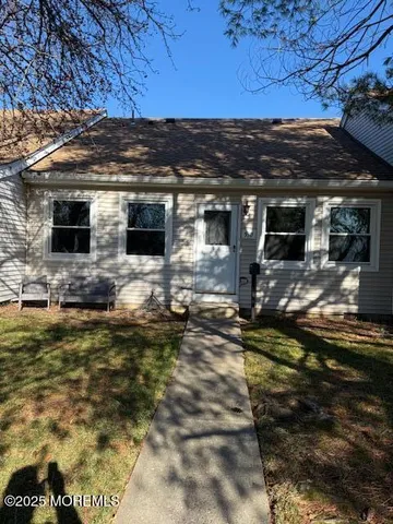 a view of backyard with swimming pool