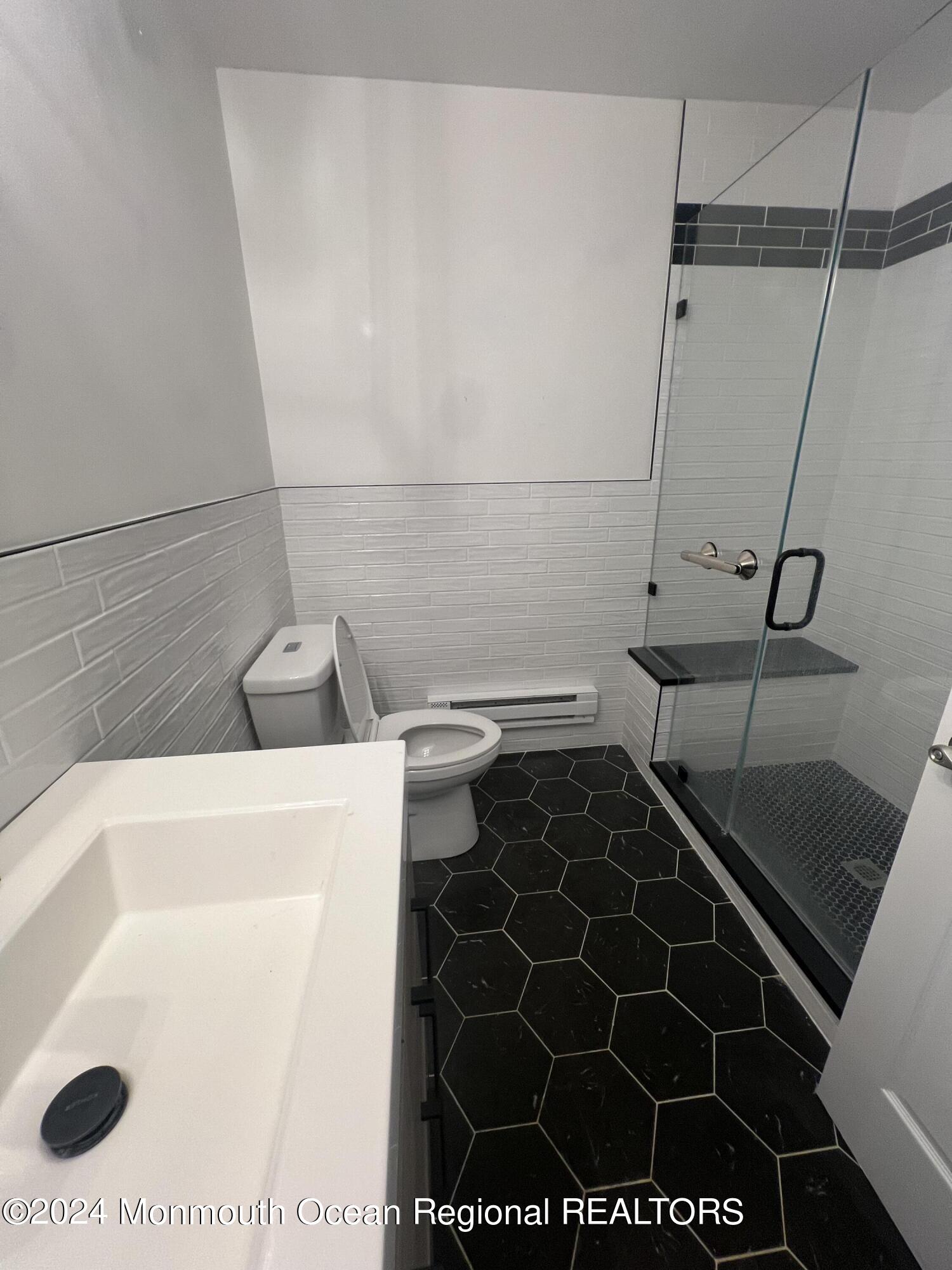 93 Halls Croft Road, Unit D Freehold, NJ 07728 - Photo 6 of 17 a bathroom with a sink and a shower