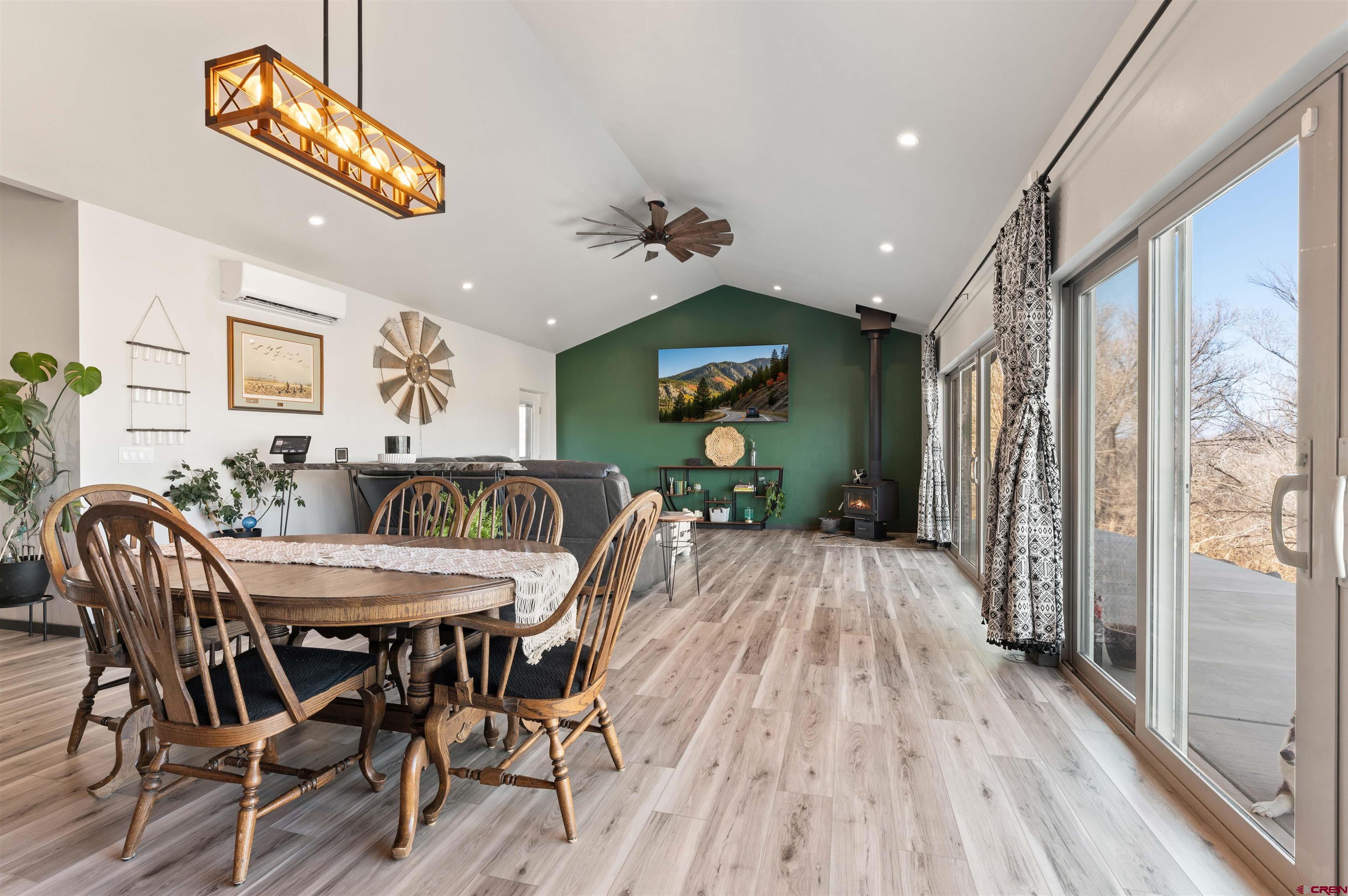 55347 Begonia Road Delta, CO 81416 - Photo 31 of 44 a view of a dining room and livingroom with furniture wooden floor a chandelier
