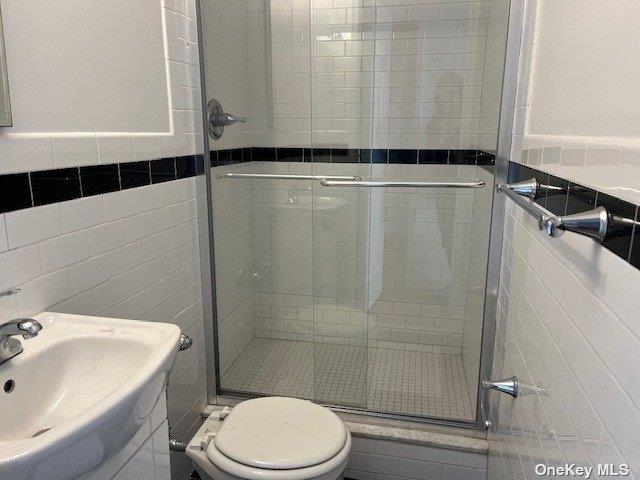 88-29 155th Avenue, Unit 6D Queens, NY 11414 - Photo 13 of 16 a bathroom with a sink toilet and shower
