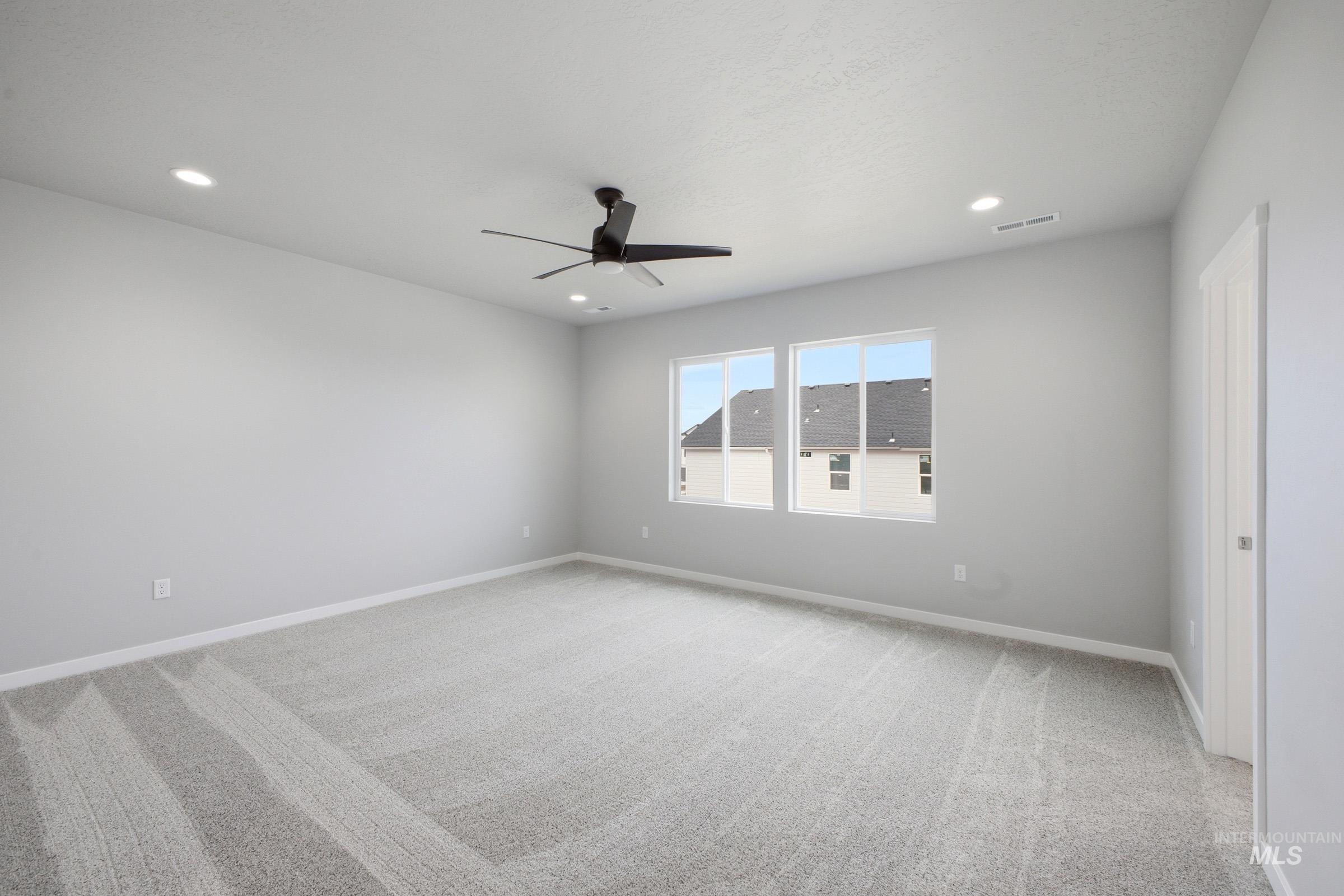 13672 Redway Court Caldwell, ID 83607 - Photo 27 of 34 Unfurnished room with light colored carpet, ceiling fan, and recessed lighting