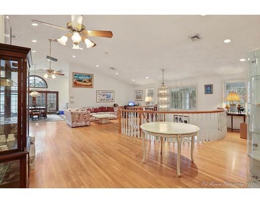 216 Haverhill Road Topsfield, MA 01983 - Photo 13 of 28 a living room with furniture a dining table and a chandelier