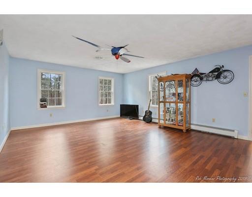 216 Haverhill Road Topsfield, MA 01983 - Photo 16 of 28 a view of an empty room with a window and wooden floor