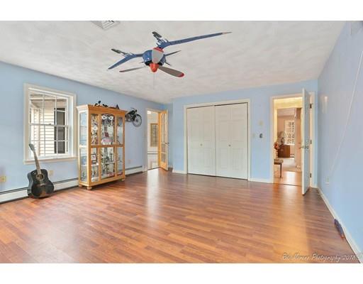216 Haverhill Road Topsfield, MA 01983 - Photo 17 of 28 a view of an empty room with window and wooden floor