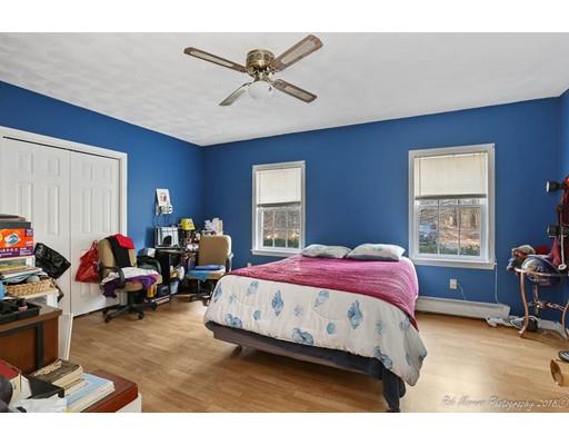 216 Haverhill Road Topsfield, MA 01983 - Photo 21 of 28 a bedroom with a bed gym equipment and a window