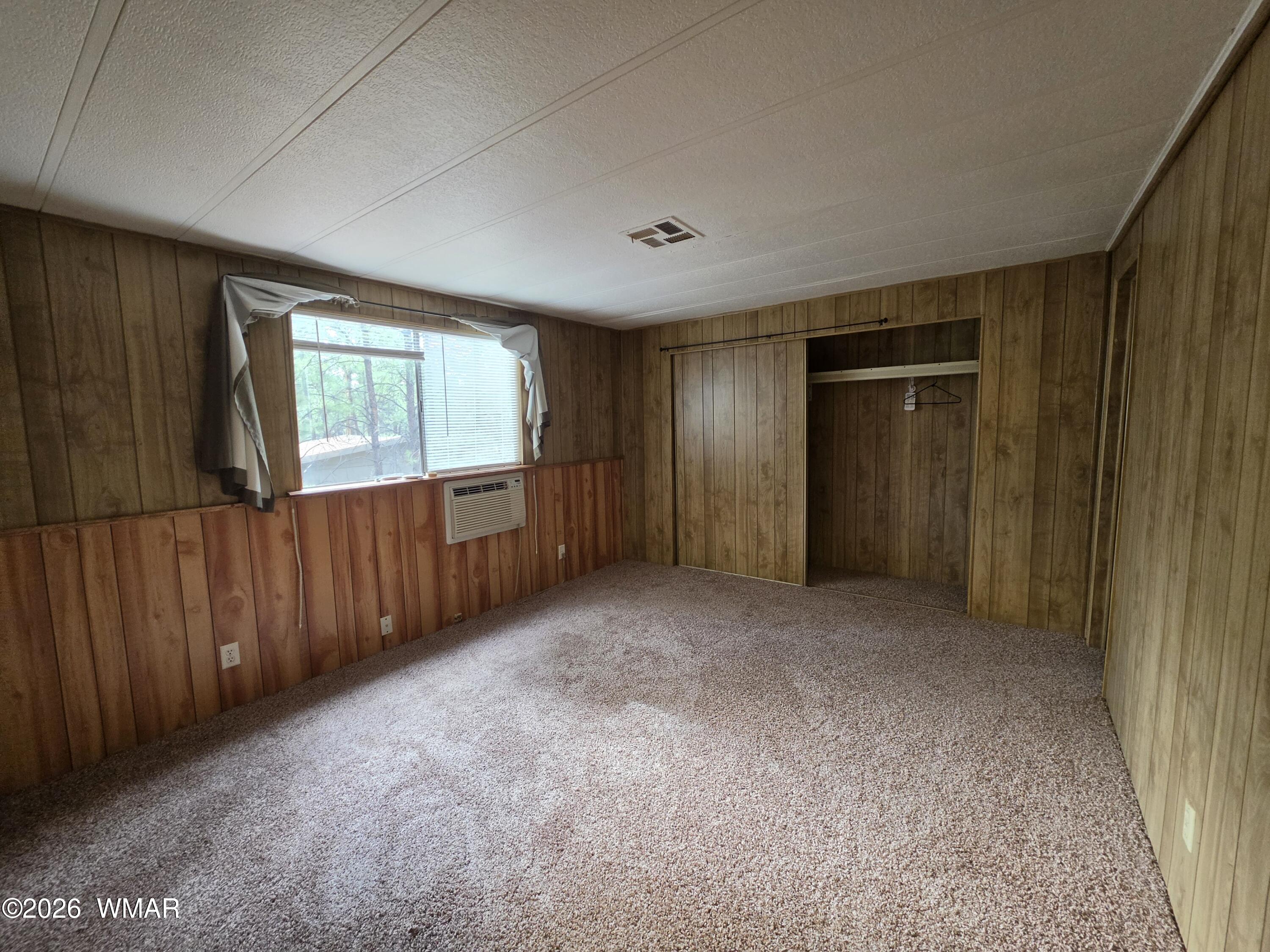 2800 South White Mountain Road, Unit 84 Show Low, AZ 85901 - Photo 12 of 13 an empty room with windows