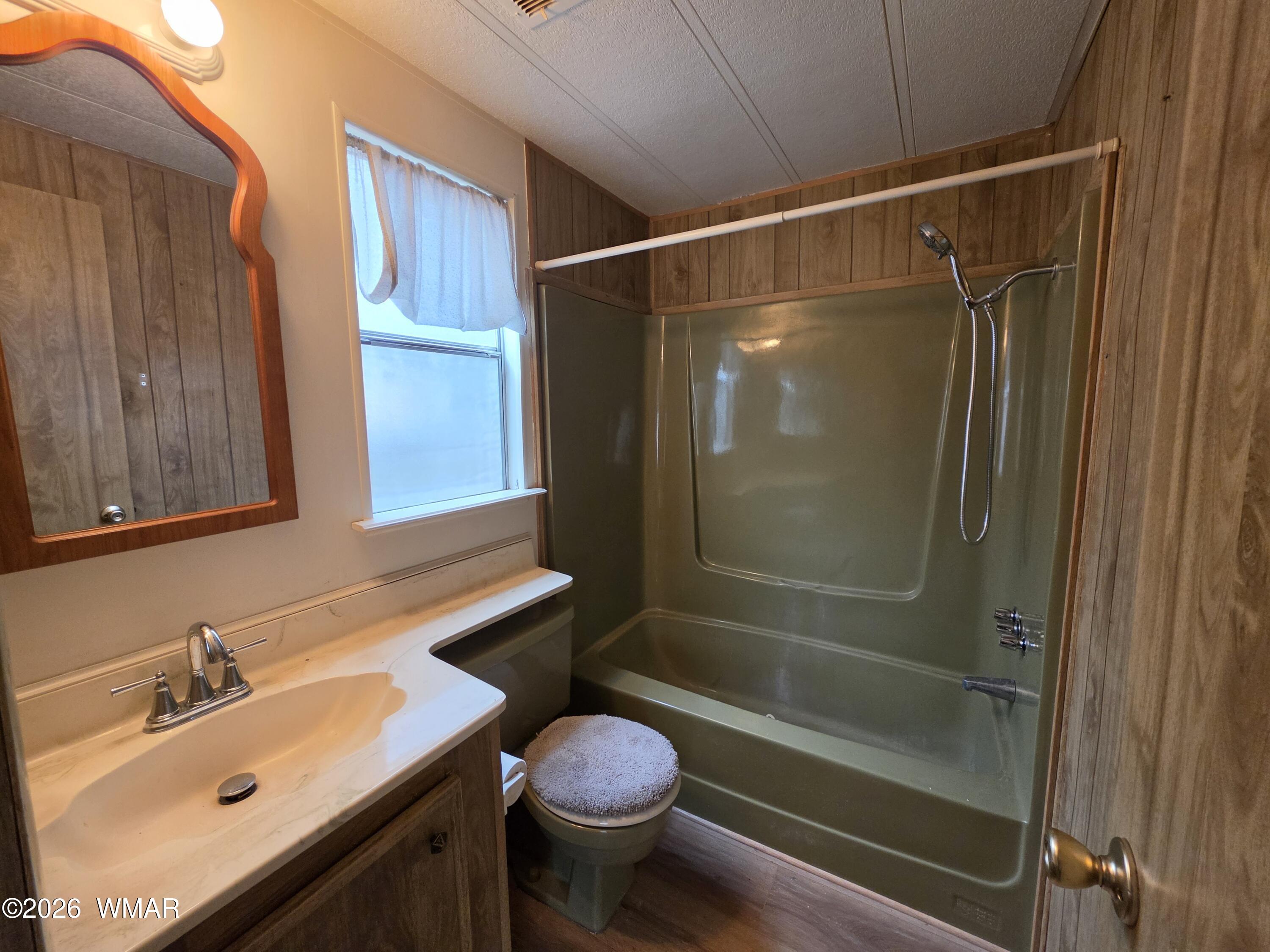 2800 South White Mountain Road, Unit 84 Show Low, AZ 85901 - Photo 13 of 13 a bathroom with a sink toilet and shower