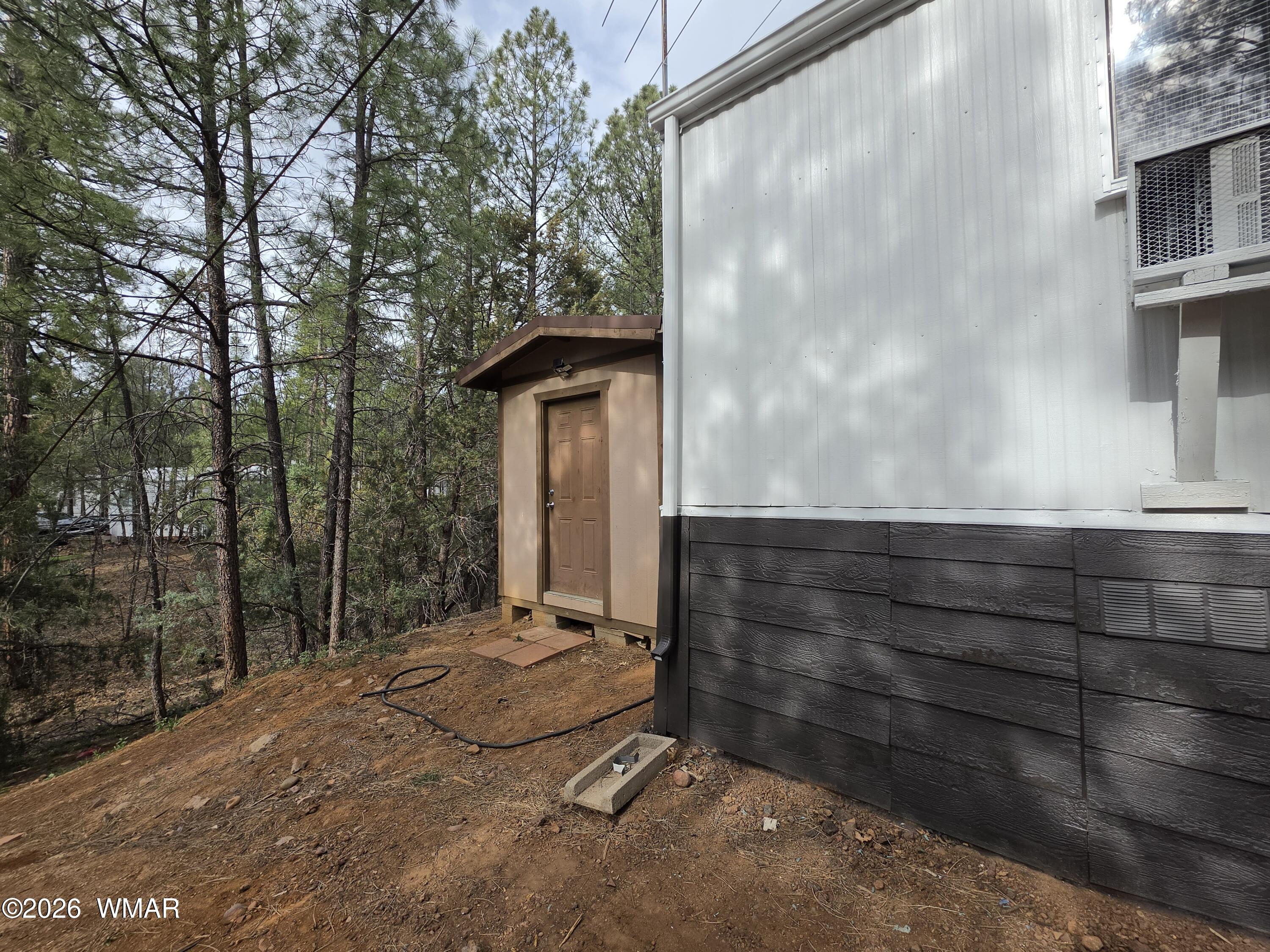2800 South White Mountain Road, Unit 84 Show Low, AZ 85901 - Photo 3 of 13 a view of backyard with wooden fence