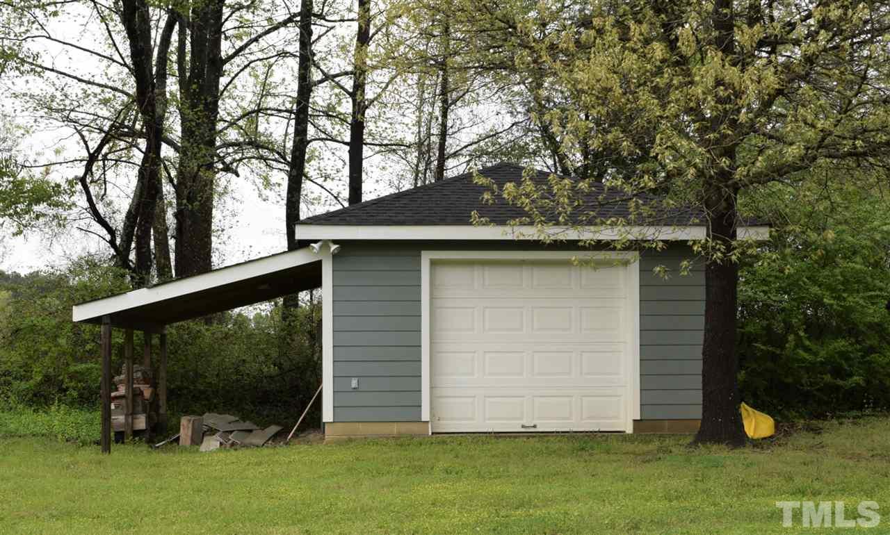 109 Watkins Farm Road Rolesville, NC 27571 - Photo 22 of 23 Extra storage plus covered area for parking lawn mower, etc.
