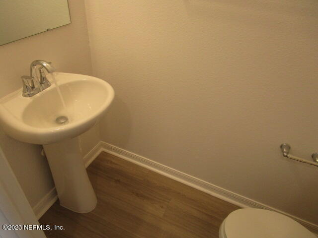 4165 Deer Trce Lane Jacksonville, FL 32257 - Photo 5 of 13 a bathroom with a sink and toilet