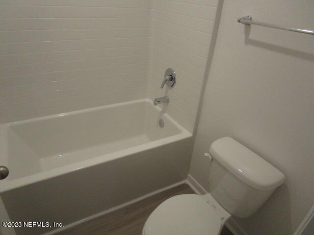 4165 Deer Trce Lane Jacksonville, FL 32257 - Photo 8 of 13 a white toilet sitting next to a bath tub
