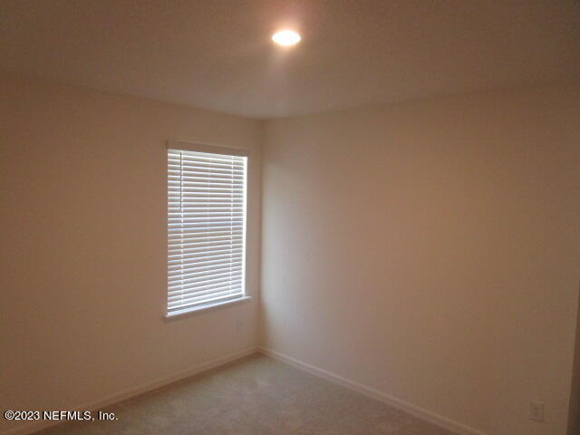 4165 Deer Trce Lane Jacksonville, FL 32257 - Photo 10 of 13 a view of an empty room with a window