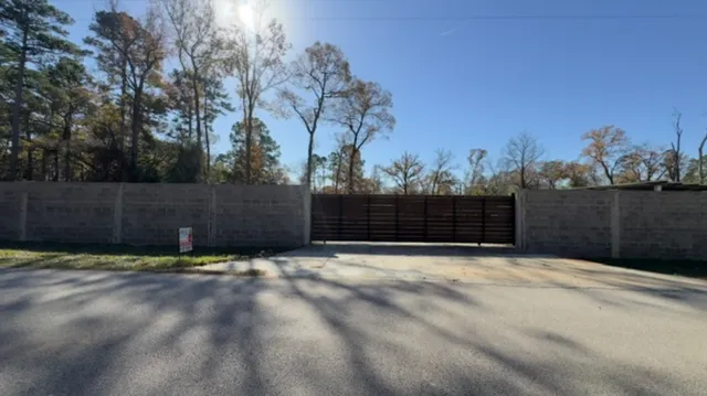 a view of outdoor space with wooden fence