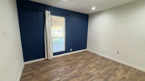 a view of an empty room and window