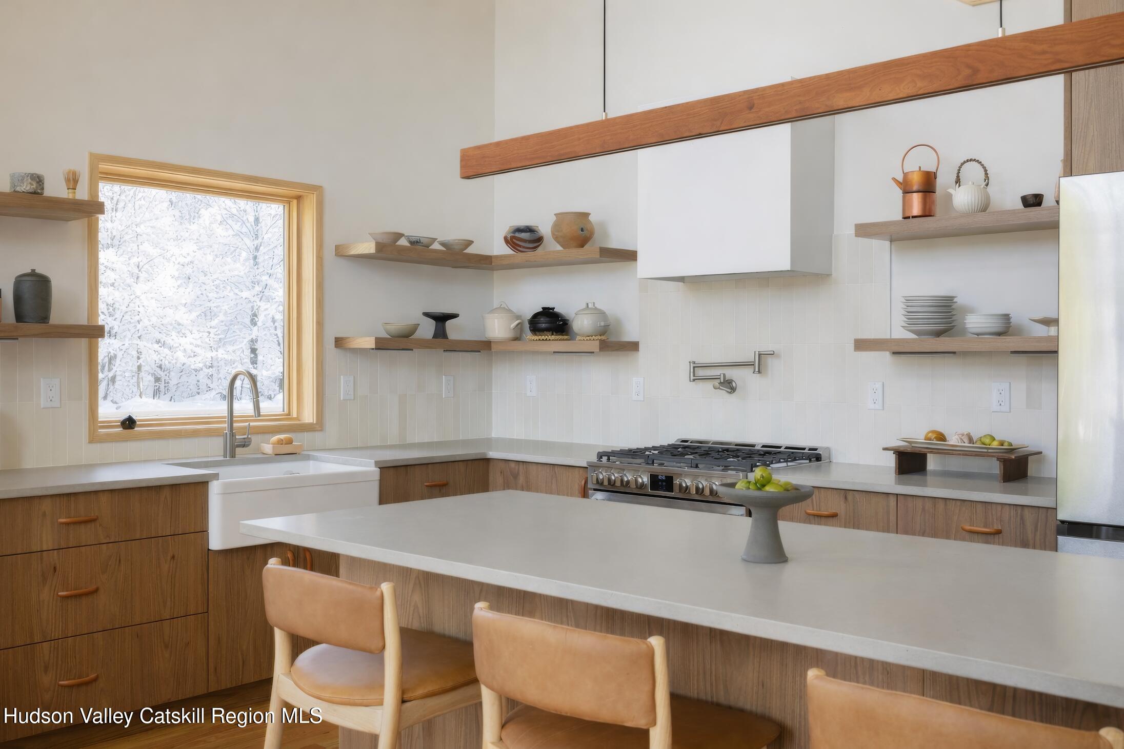 130 Abromowitz Road Wawarsing, NY 12428 - Photo 11 of 27 a kitchen with a stove a window and cabinets