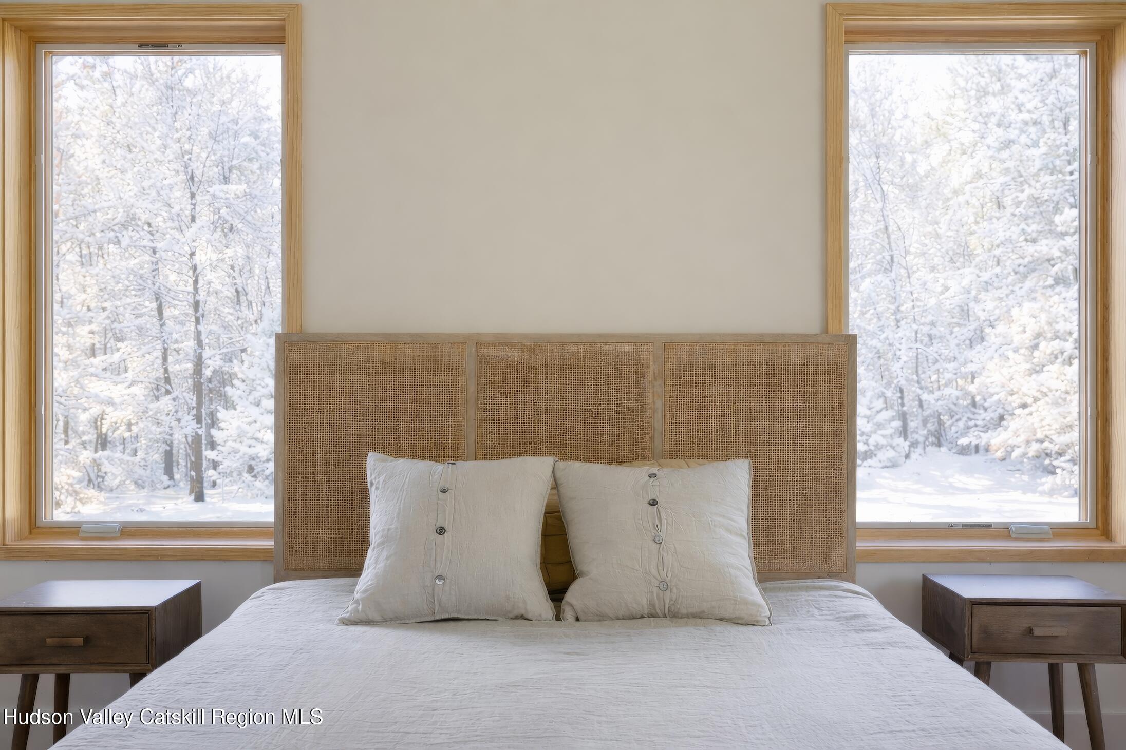 130 Abromowitz Road Wawarsing, NY 12428 - Photo 14 of 27 a large bed sitting in a bedroom next to a window