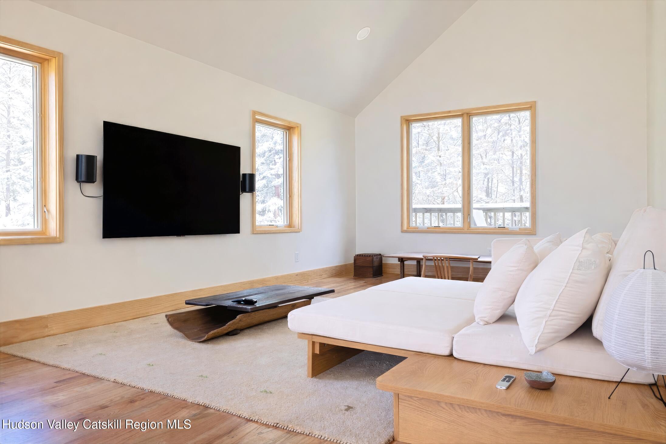 130 Abromowitz Road Wawarsing, NY 12428 - Photo 16 of 27 a living room with furniture and a flat screen tv