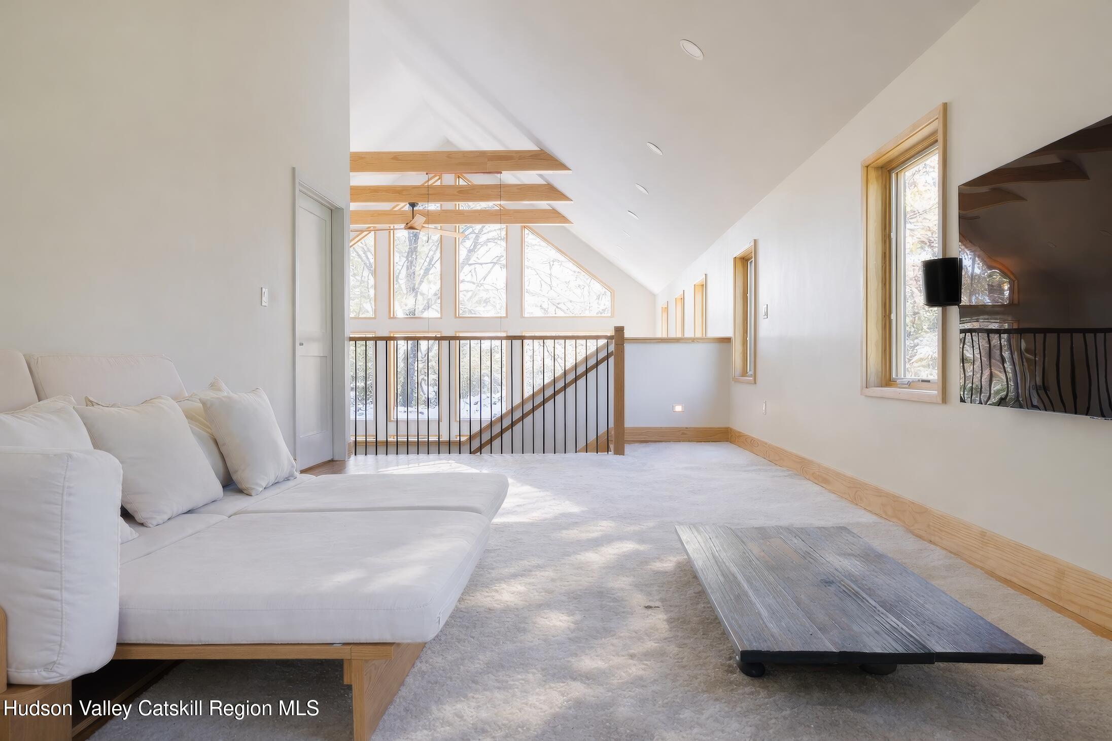 130 Abromowitz Road Wawarsing, NY 12428 - Photo 17 of 27 a bedroom with furniture and a flat screen tv