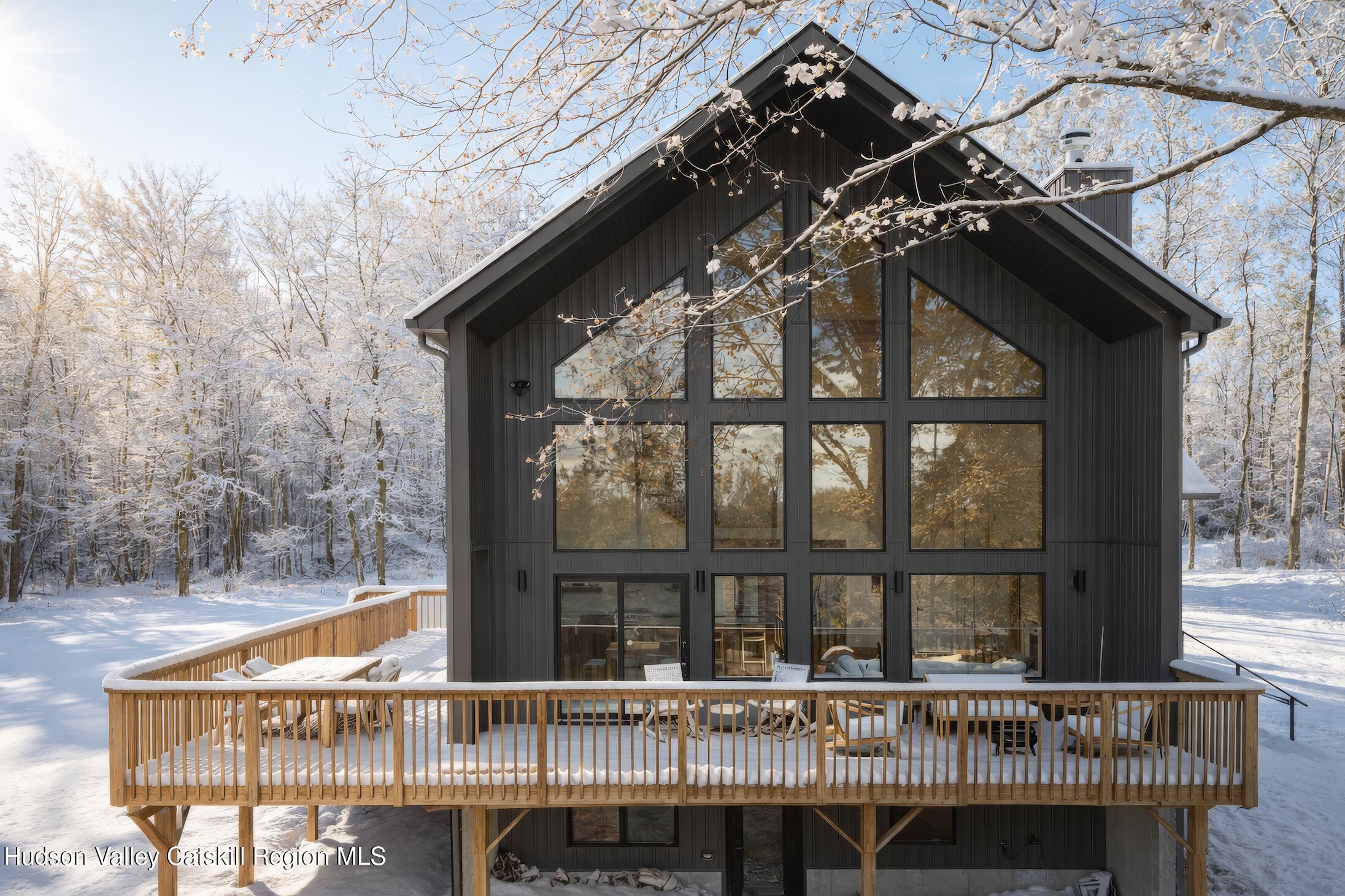 130 Abromowitz Road Wawarsing, NY 12428 - Photo 24 of 27 a balcony of a house with wooden floor and outdoor seating