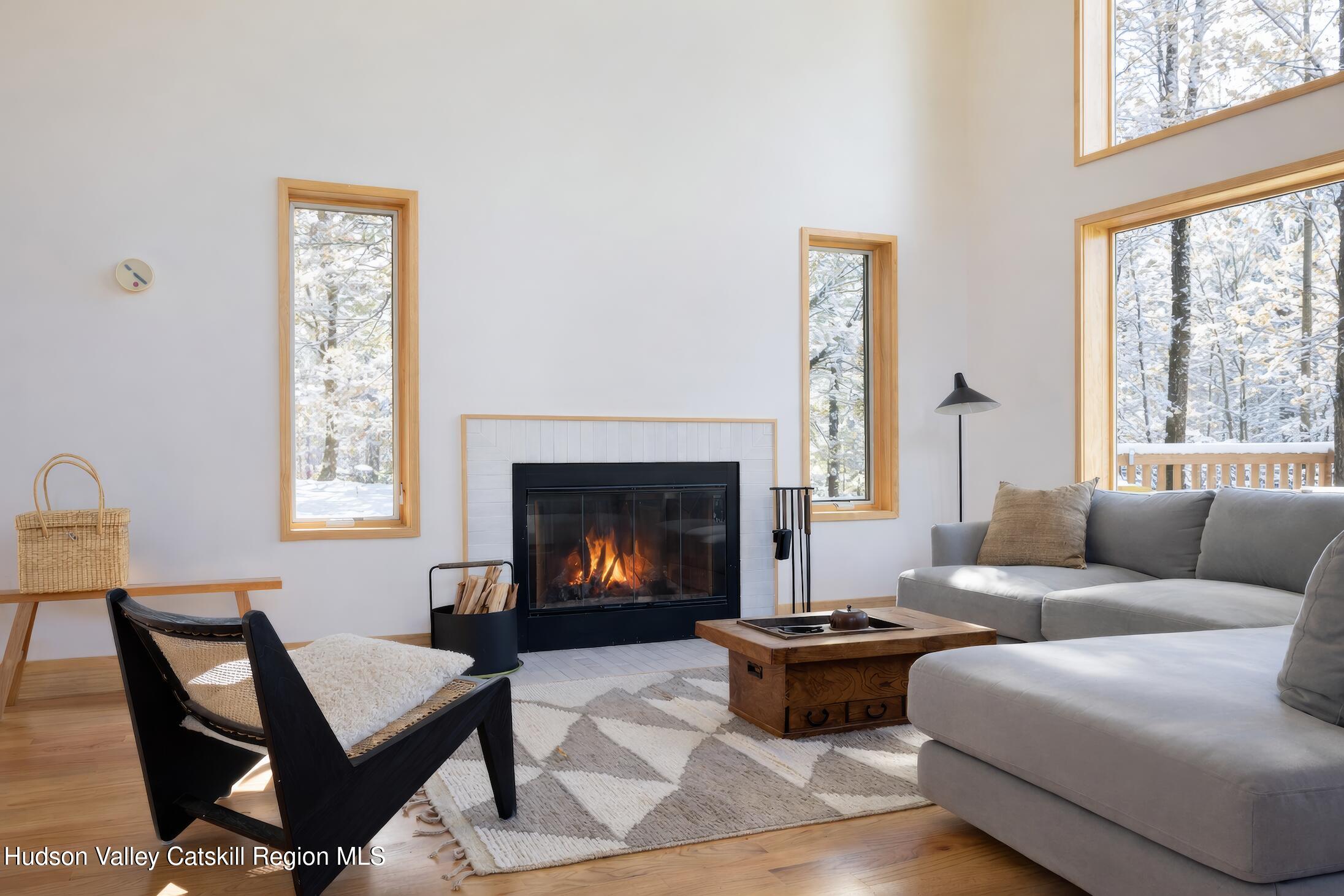 130 Abromowitz Road Wawarsing, NY 12428 - Photo 6 of 27 a living room with furniture fireplace and window