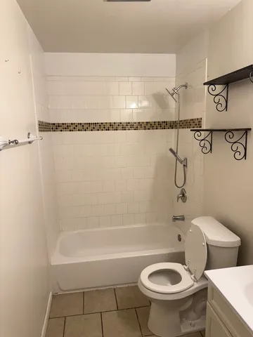 a bathroom with a sink a toilet and a bathtub