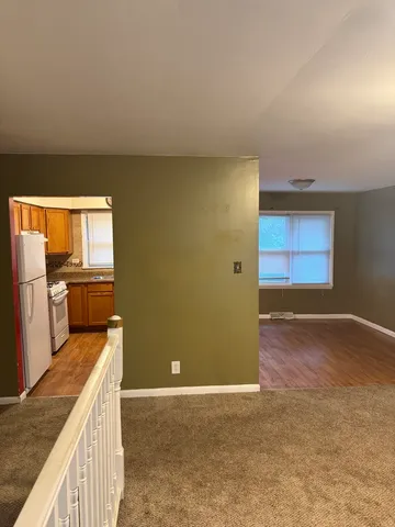 a kitchen with stainless steel appliances granite countertop a sink and cabinets
