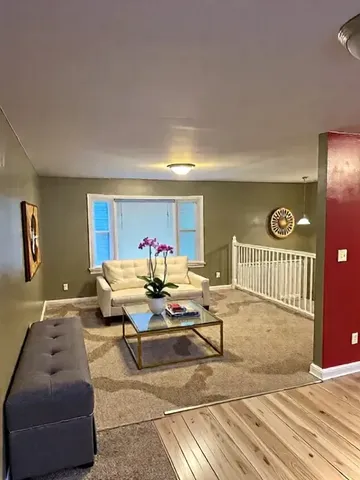 a living room with furniture and a table