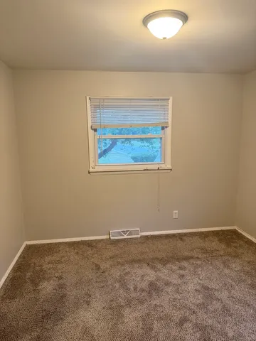 an empty room with a workbench