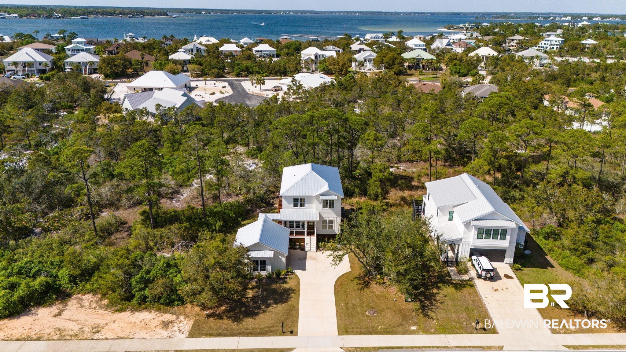 30449 River Road Orange Beach, AL 36561 - Photo 30 of 39 Aerial perspective of suburban area with a large body of water