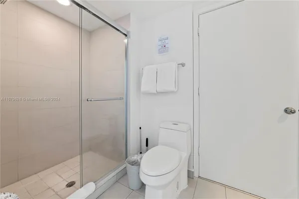 a bathroom with a shower and a toilet