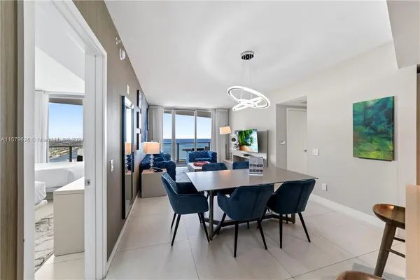 a view of a dining room with furniture and a livingroom