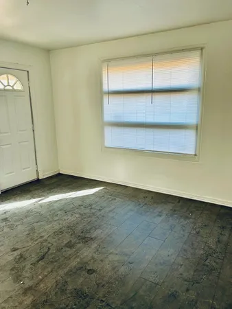 an empty room with a empty space and window